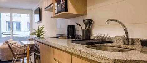 Coffee/tea maker, fridge, microwave, oven