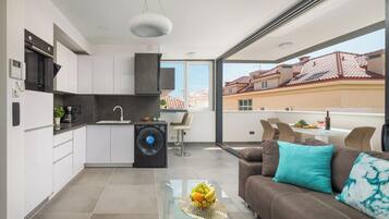 Luxury Penthouse | Private kitchen | Full-sized fridge, oven, stovetop, dishwasher