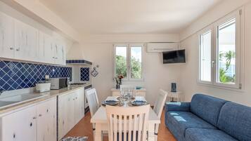 Basic House, Sea View | Living area | 32-inch TV with digital channels