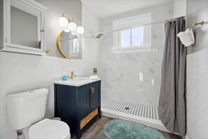 Shower, hair dryer, towels, shampoo