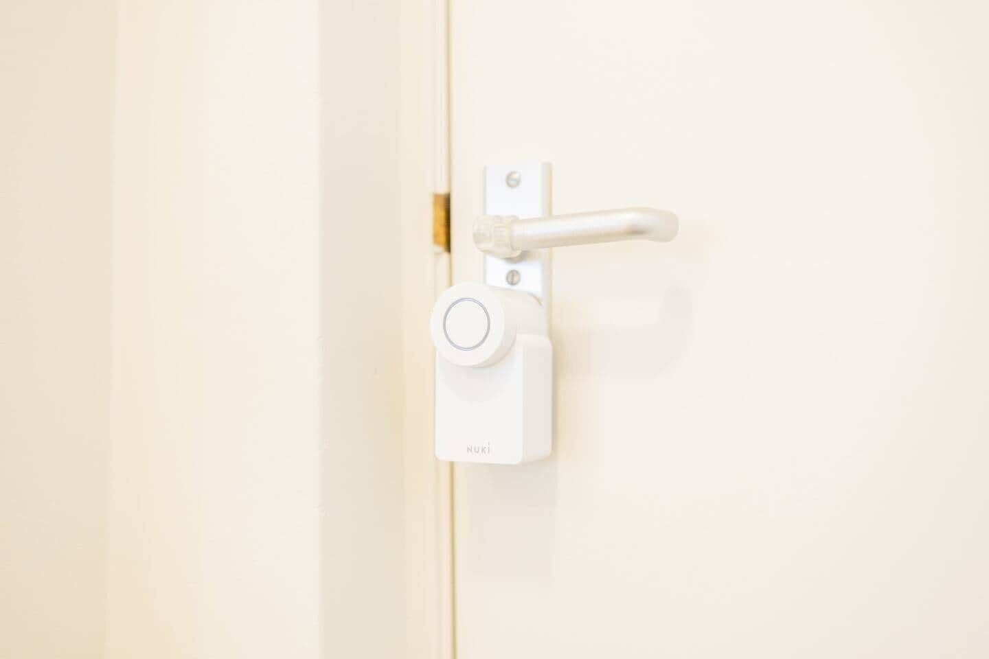 A white door with a simple latch and a keyhole.