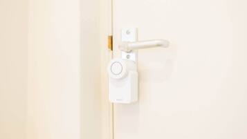 A white door with a simple latch and a keyhole.