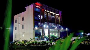 A multi-story hotel with a prominent sign for the "RBS Hotel & Lawn" and a "Banquet" section. - RBS Hotel And Lawn (Faizabad)
