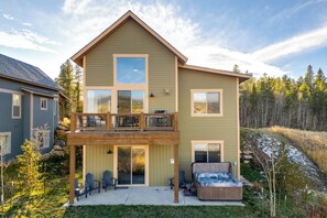 A two-story house with a balcony, a hot tub, and a covered patio area. - 5 Mi to Winter Park Resort: Fraser Family Home (Fraser)
