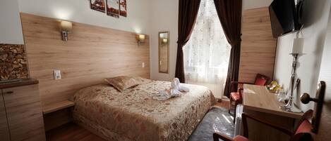 Standard Room, City View | Desk, laptop workspace, iron/ironing board, free WiFi