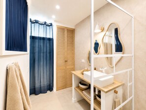 Shower, eco-friendly toiletries, hair dryer, towels