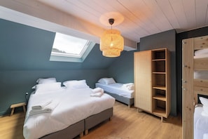 A bedroom with a skylight, two beds, a wooden wardrobe, and a woven light fixture. - LE PERCHOIR - 14 guests - Lake view - Sauna, Gérardmer (Gérardmer)