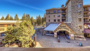 A multi-story building with a stone facade and a large arched entrance labeled "Big Springs Resort & Condado."