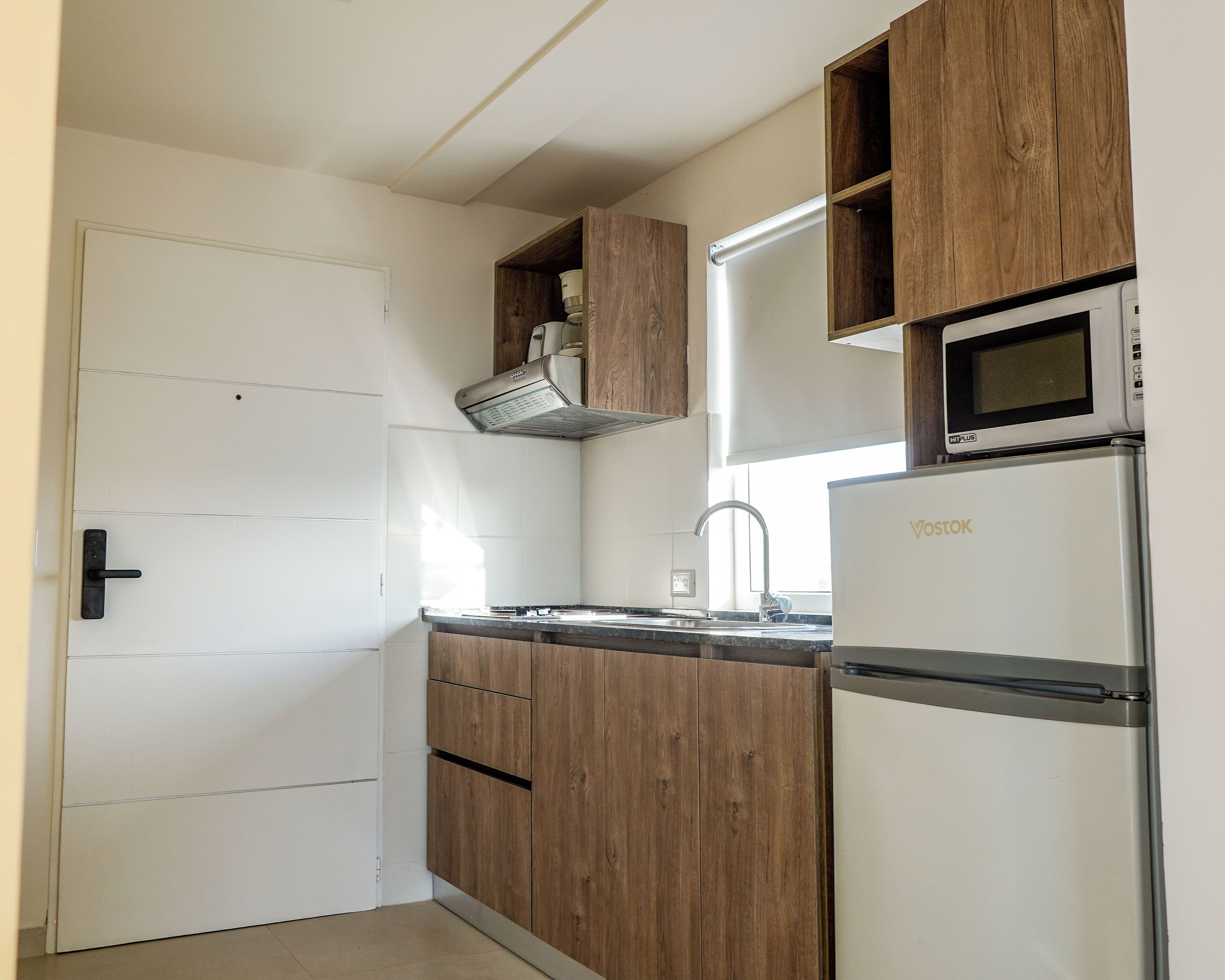 Deluxe Studio, Balcony | Private kitchen | Full-sized fridge, microwave, stovetop, cookware/dishes/utensils