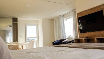 Premium bedding, down comforters, pillowtop beds, in-room safe