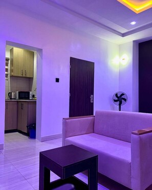 Appartement Deluxe, balcon, vue ville | Coin séjour