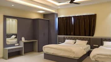 Deluxe Triple Room, City View | Desk, laptop workspace, iron/ironing board