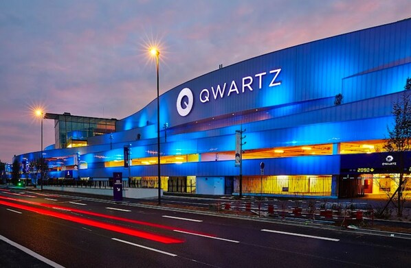 A modern building with the sign "QWARTZ" prominently displayed.