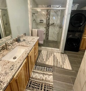 Shower, eco-friendly toiletries, hair dryer, towels