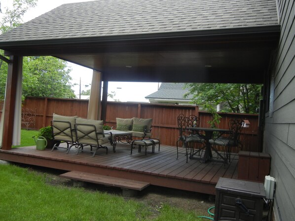 An outdoor patio with a wooden deck, metal chairs, a table, and a grill. - Moose Traks
Come stay in Downtown Red Lodge, 2 blocks from Broadway Street (Red Lodge)