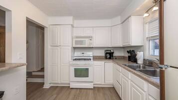 Apartment, Multiple Beds, Patio (Grand Elm Suites) | Private kitchen | Fridge, microwave, oven, stovetop