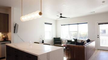 Deluxe Apartment, City View | Living area | TV