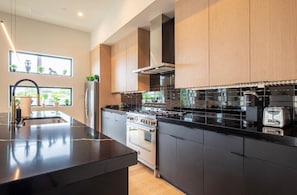 Coffee/tea maker, fridge, microwave, oven