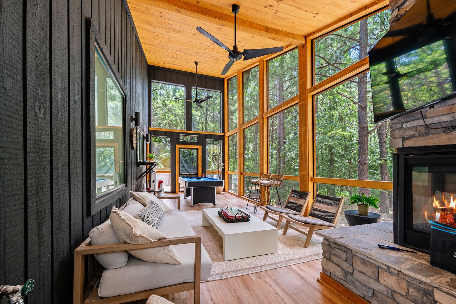 Screened-in Porch: Play games, unwind by the fire, and soak in the forest views.