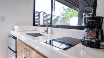 Fridge, coffee/tea maker, cookware/dishes/utensils