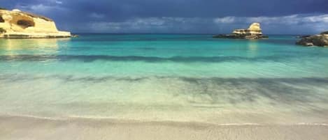 On the beach, sun-loungers
