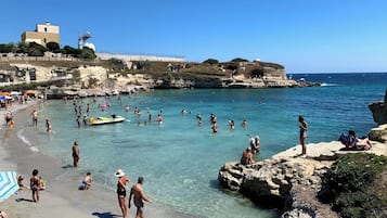 On the beach, sun-loungers