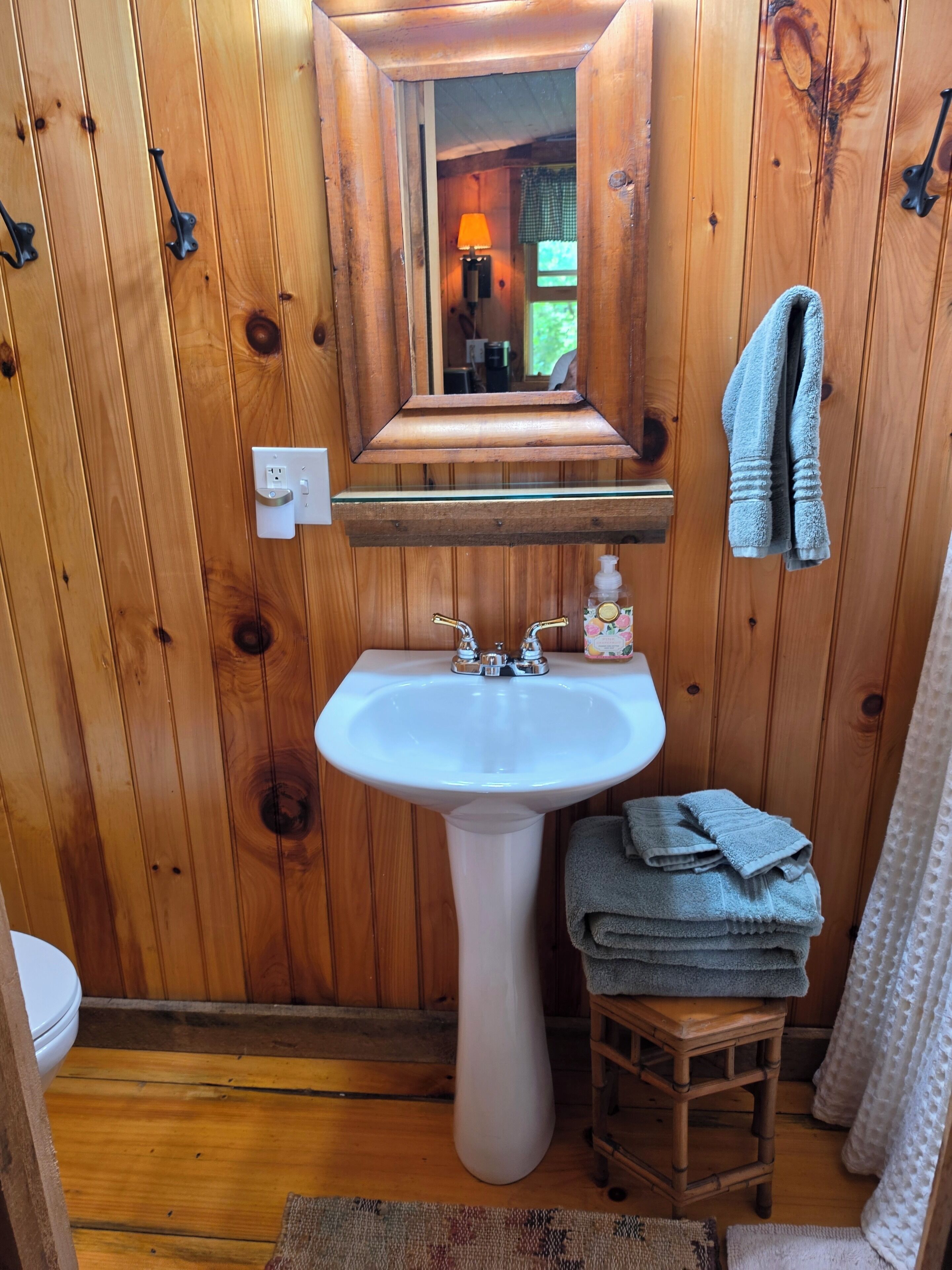 Shower, towels, soap, toilet paper