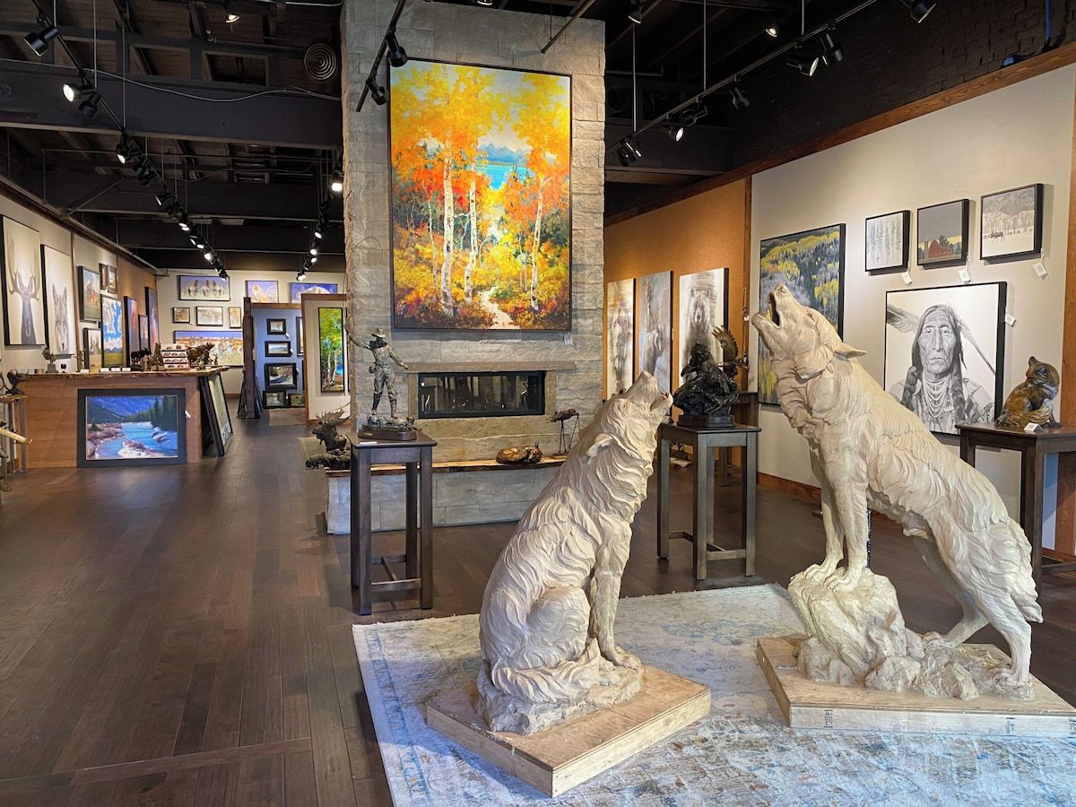 An art gallery with sculptures and paintings.
