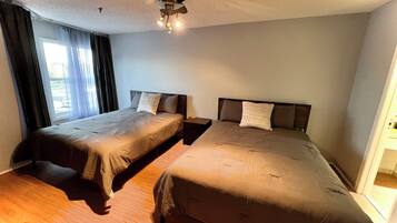 1 bedroom, desk, iron/ironing board, travel crib