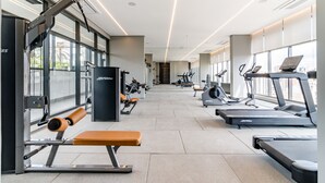 A modern gym with treadmills, weight machines, and benches. - Refuge in S o Paulo With Swimming Pool Sp-p2003b (São Paulo)