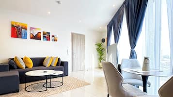 Superior Apartment, 1 Bedroom, City View | Living area | 55-inch Smart TV with digital channels