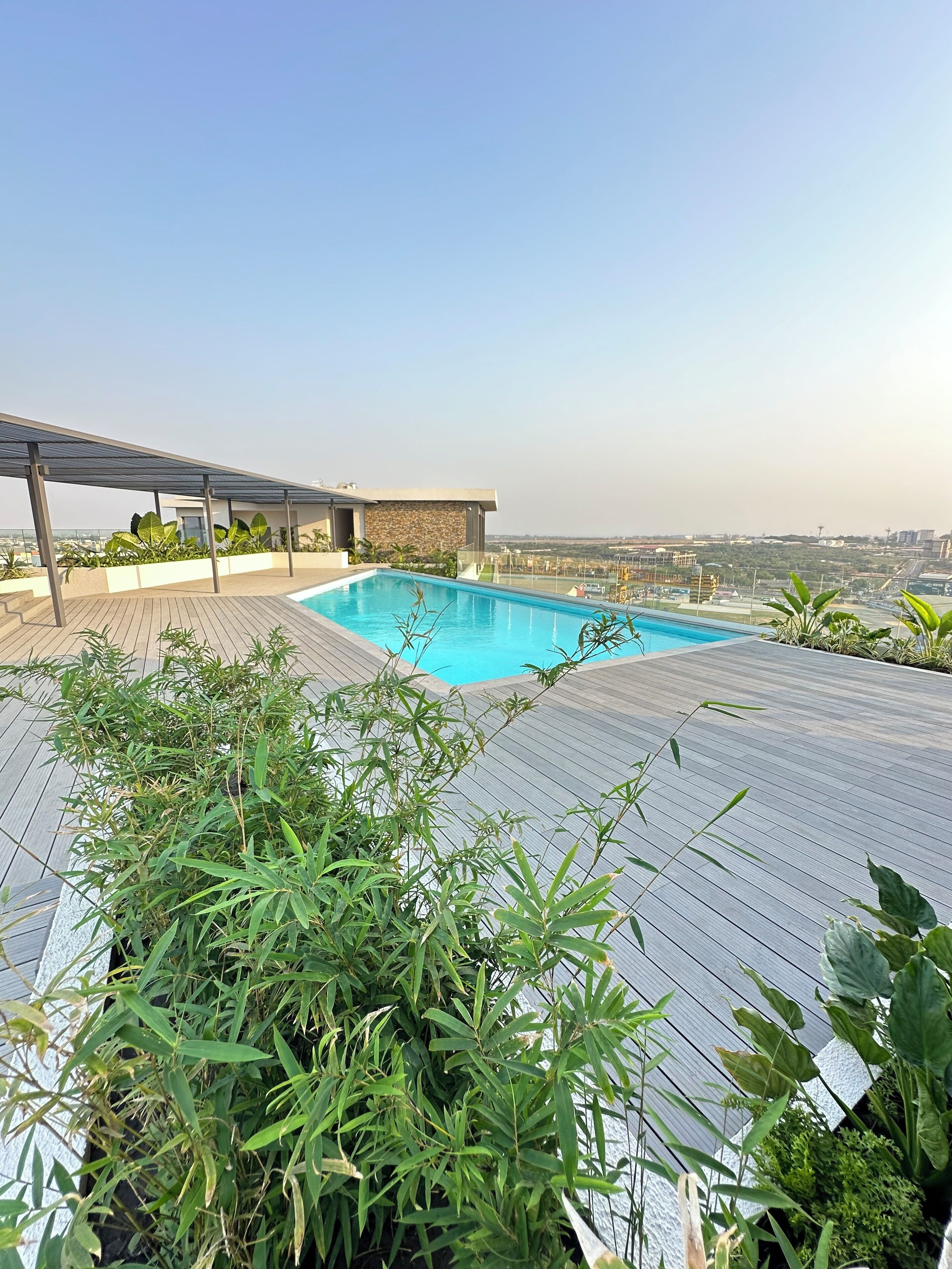 A rooftop pool with a clear view of the cityscape.