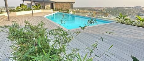 A rooftop pool with a clear view of the cityscape.