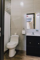 Economy Single Room | Bathroom | Shower, towels, soap, shampoo