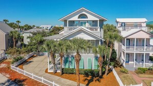 A two-story beachfront property with a balcony, a covered patio, and a white picket fence. - Private Pool 🏊 Walk to Beach 🏖️ Family Tides 🏝️ (Destin)