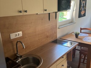 Fridge, microwave, cookware/dishes/utensils