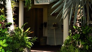 A pathway leading to an office with a sign that reads "Office." - Kaua'i Palms Hotel (Lihue)