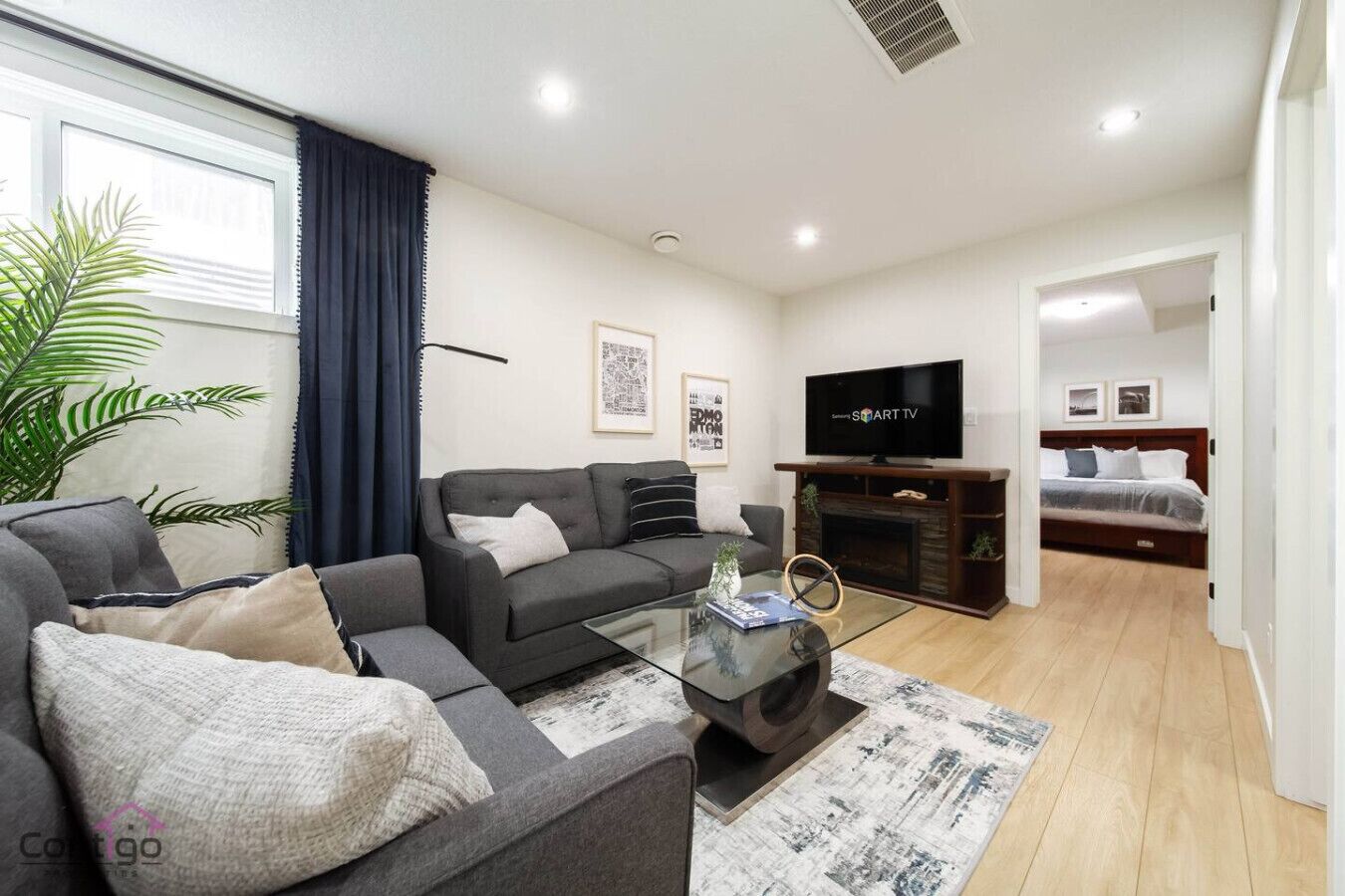 Smart TV, fireplace, books, offices