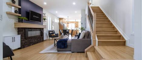 Smart TV, fireplace, books, offices