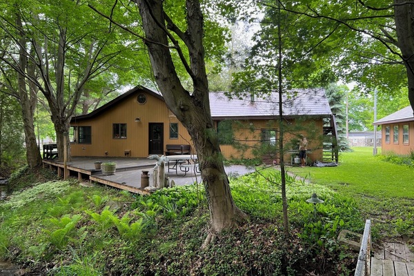 A peaceful stream gently flows at the back of the property, adding to the tranquility of the setting.