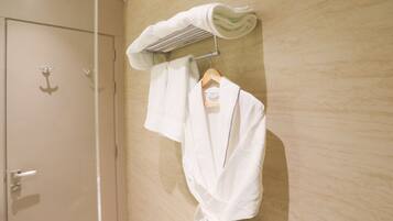 Shower, hair dryer, towels, toilet paper