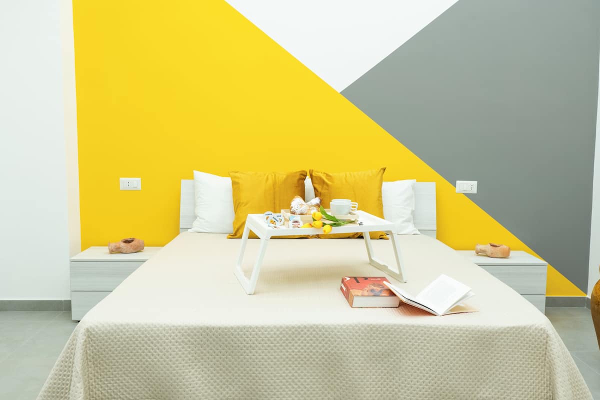 Familiekamer, uitzicht op tuin | Verduisterende gordijnen, gratis wifi