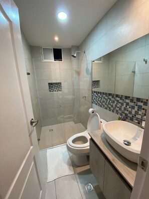 Shower, hair dryer, towels, soap