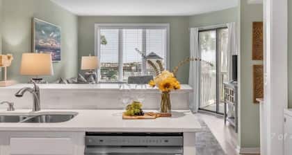 New Listing! Tidewater Ocean View! Steps from the Beach! Screened in Porch!