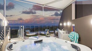 A rooftop terrace with a hot tub, seating areas, and a scenic view of the sunset. - 1322 Luxury Beachfront Penthouse with Rooftop Jacuzzi (Kingscliff)