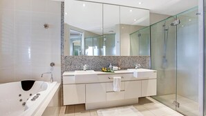 A modern bathroom with a glass-enclosed shower, a double sink vanity, and a freestanding bathtub. - 1322 Luxury Beachfront Penthouse with Rooftop Jacuzzi (Kingscliff)
