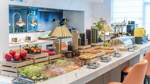 A buffet with various food items and a modern interior design. - Holiday Inn Express Haikou World Trade Center by IHG (Haikou)