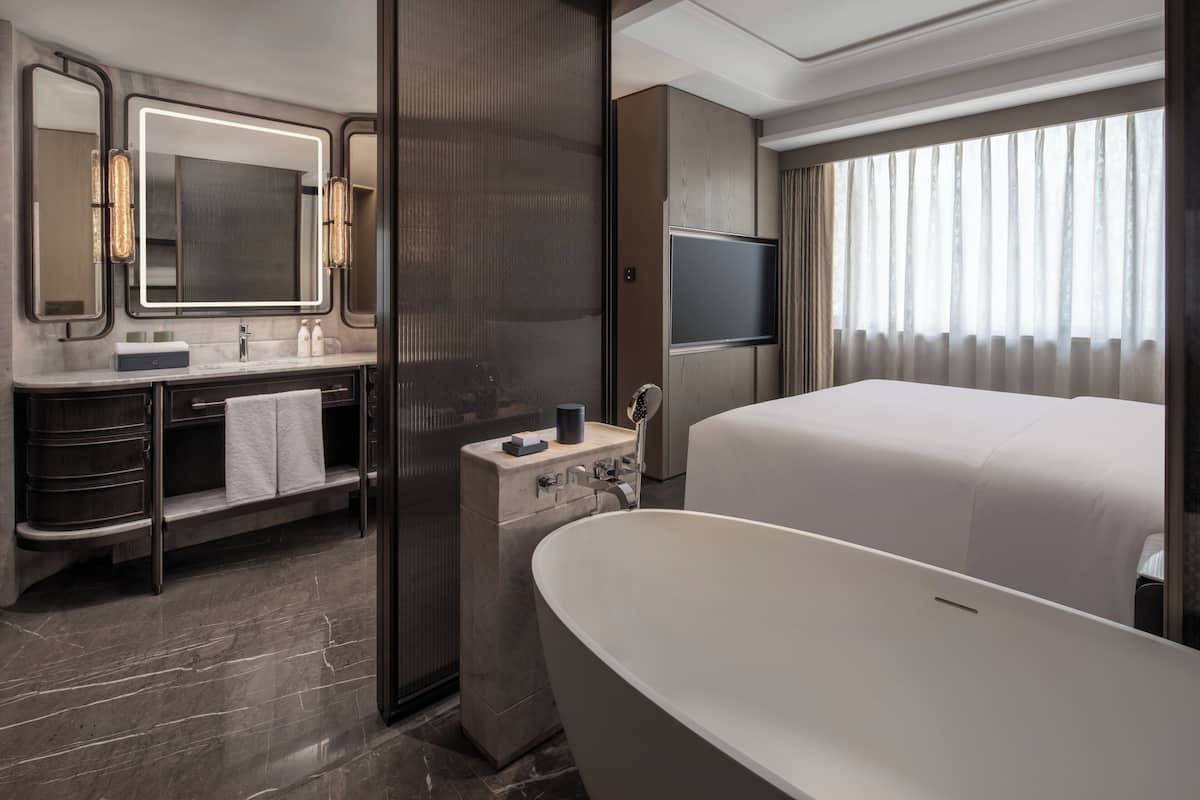 Separate bathtub and shower, rainfall showerhead, designer toiletries