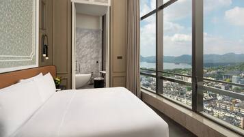 Premium bedding, down comforters, minibar, in-room safe