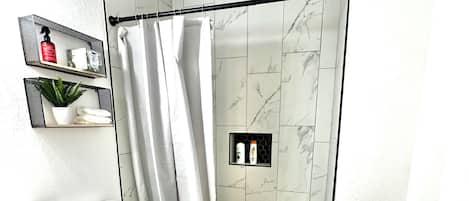 Shower, hair dryer, towels, soap